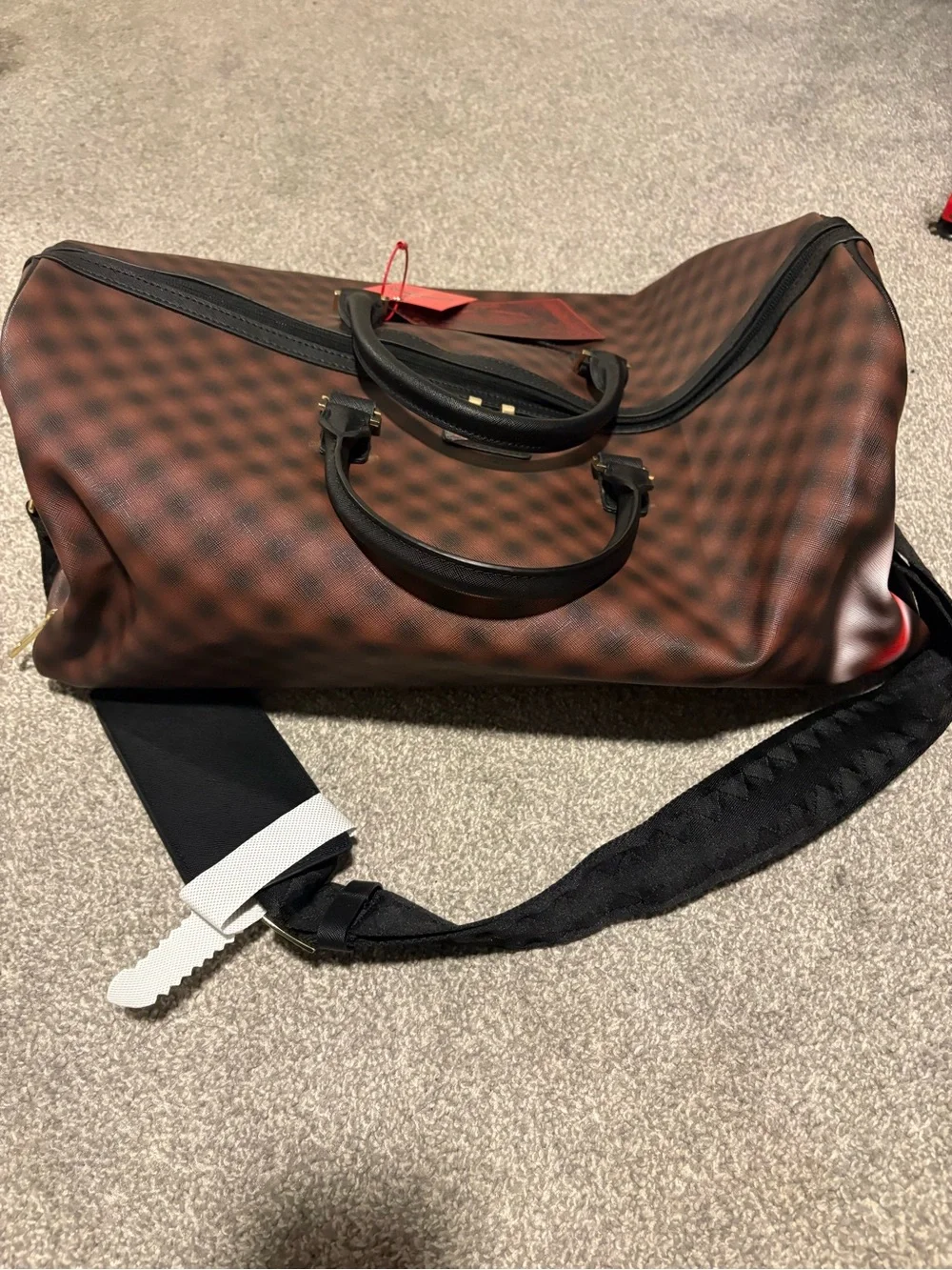 Bape Brown Checked Duffel Bag with Black Handles and Red Tag